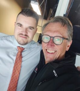 With Wheat Kings game announcer Chase Johnston